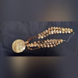 Women.. necklace; brown and gold colored